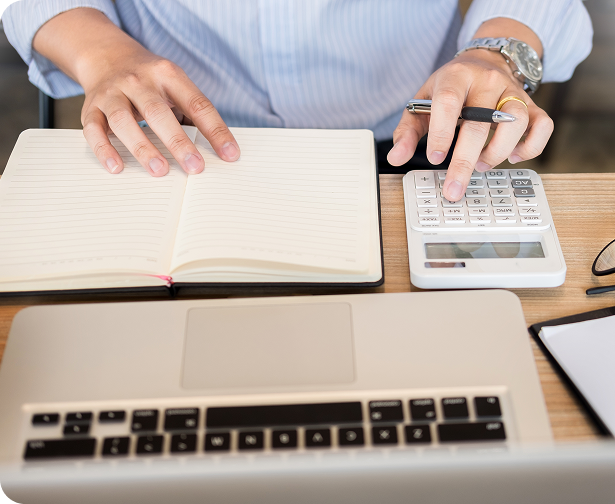 Hands working on bookkeeping review